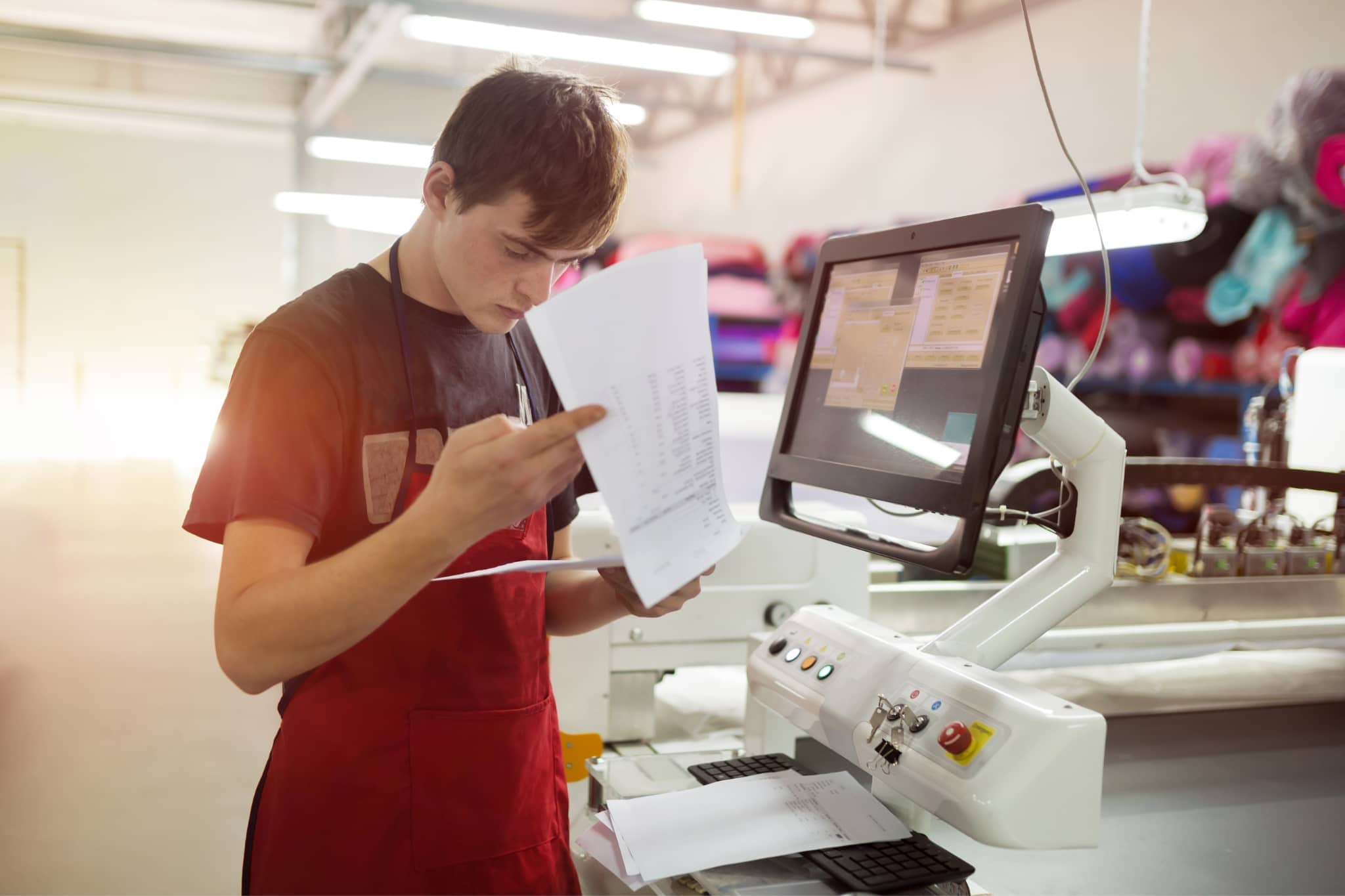 Worker working on a printing machine - Pearson TalentLens