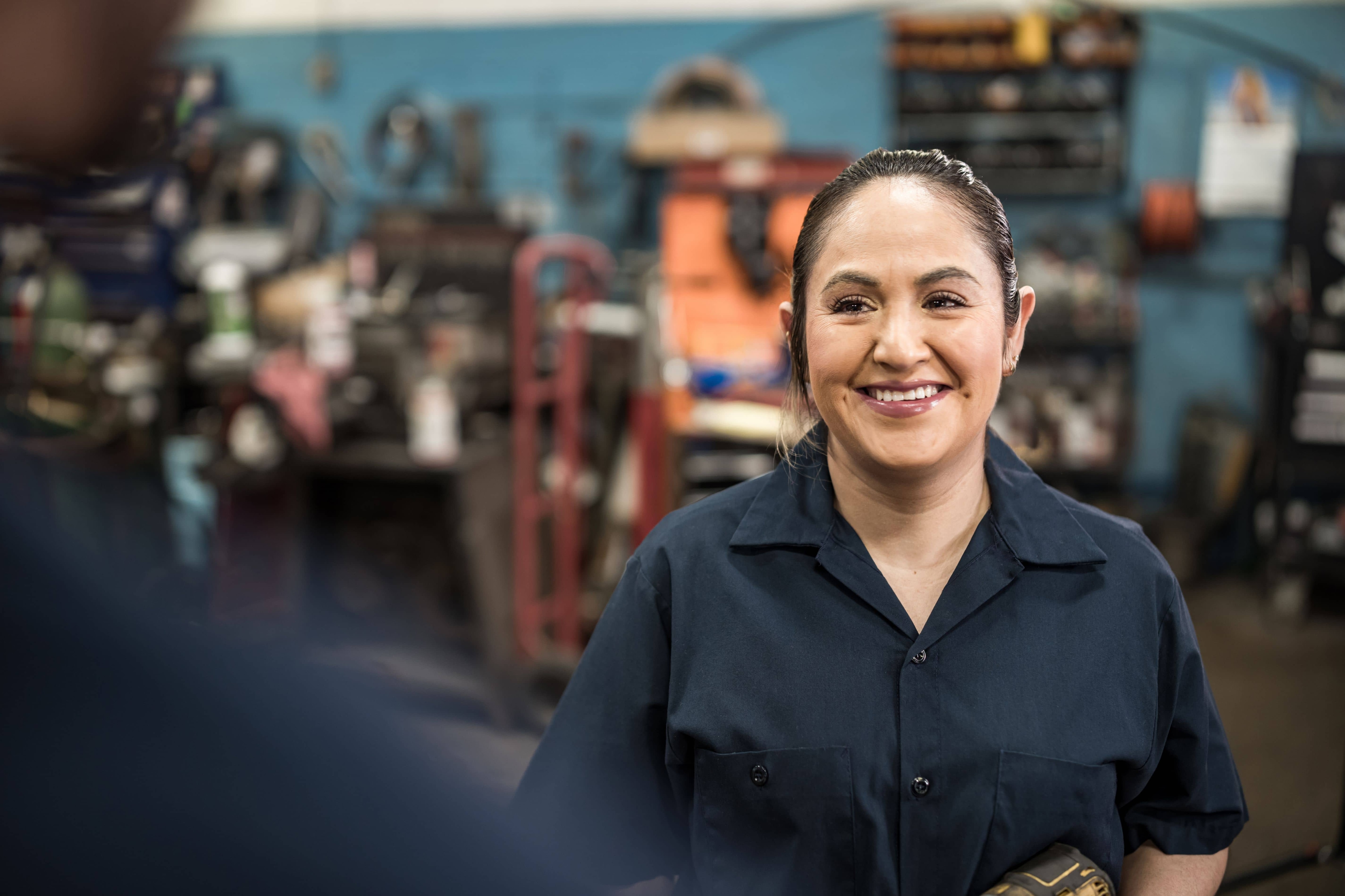 A female mecanic in her workshop - Pearson TalentLens