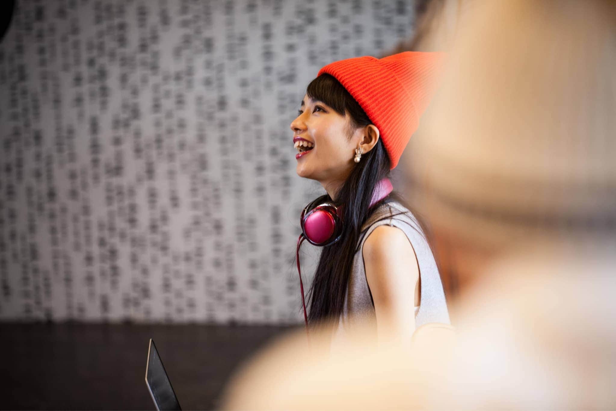 A female worker laughing - Pearson TalentLens
