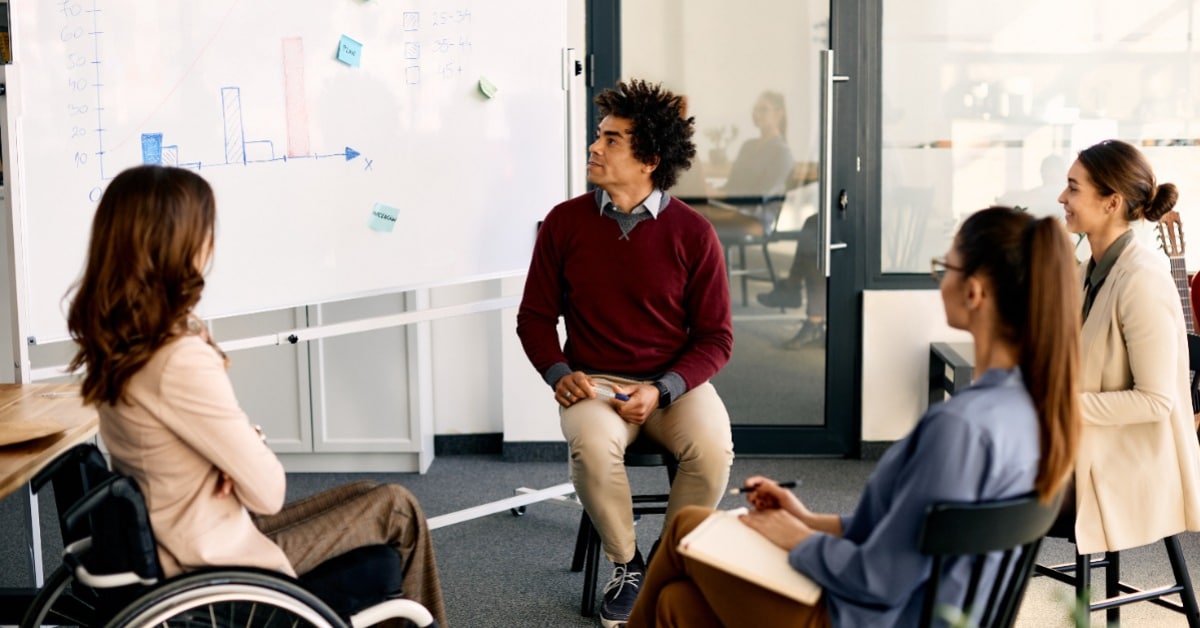 A group of team members brainstorming - Pearson TalentLens