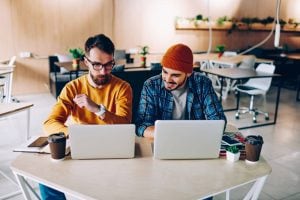Two colleages discussing power skills - Pearson TalentLens